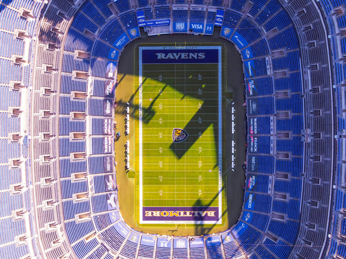Football field aerial shot with wheelchair rental customer